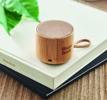 Logotrade promotional products photo of: Round bamboo wireless speaker